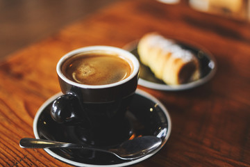 Cup of coffee with bread