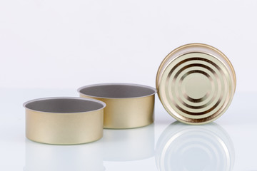 tin cans on white background with reflection