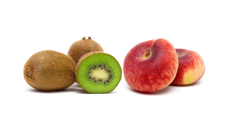 Kiwi and peaches isolated on white background.