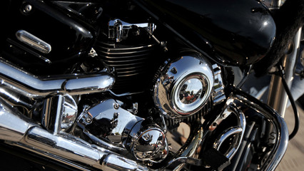Closed chromed motorcycle engine. Small details in reflection