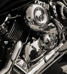 Closed chromed motorcycle engine. Small details in reflection