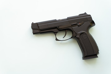 Black hand gun used for protection isolated over white background. Pneumatic pistol for defense. Isolated shot of modern weapon.