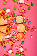 Fototapeta na wymiar Ice cream waffles cones with colorful candy
