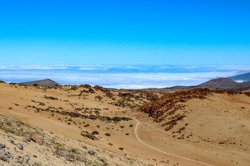 Fototapeta na wymiar Desert like Landscape above the clouds on the slopes of the Teide Mountain, Tenerife, Canary Islands, Spain