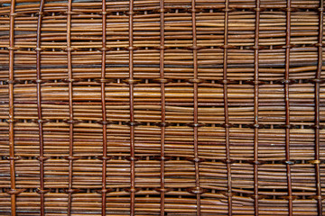 brown background, texture, wooden rods woven together