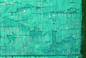 Obraz premium Old wooden background with remains of pieces of scraps of old paint on wood. Texture of an old tree, vintage wood background peeling paint. old blue board with cracked paint