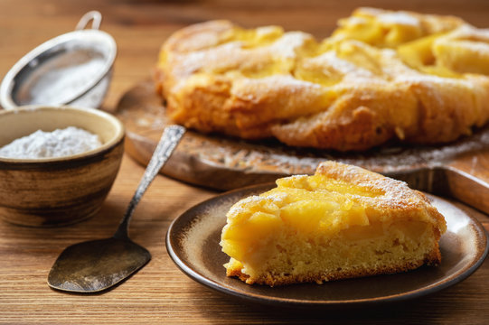 Homemade apple buiscuit pie, on wooden background.