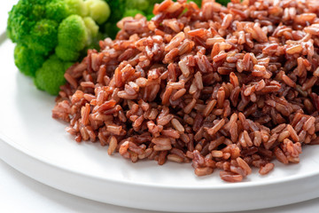 Cooked red rice on the table. Vegetarian food. Healthy food.