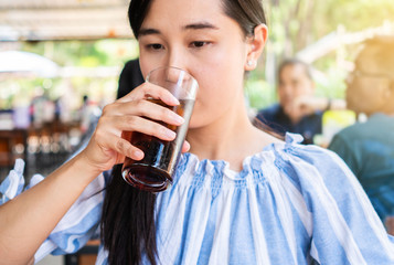 woman drinking of cola.