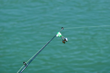 Fishing bell at the end of a fishing rod. Bells will ring when the fish is hooked