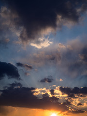 Naklejka premium Dramatic sunset sky with orange clouds.