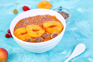 Smoothie bowls. Healthy breakfast bowl on blue background.