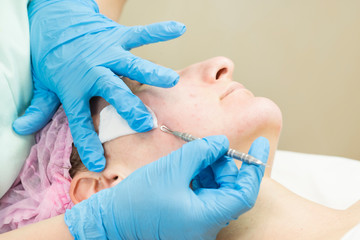 Process cosmetic mask of massage and facials in beauty salon 