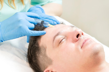 Man passes a course of mesotherapy clinic 