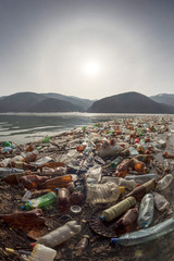 Spring flood and shore with garbage