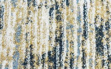 Texture of the carpet with an abstract pattern. Сarpet background with multi-colored stripes.