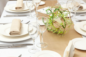 The served table with beautiful setting in restaurant