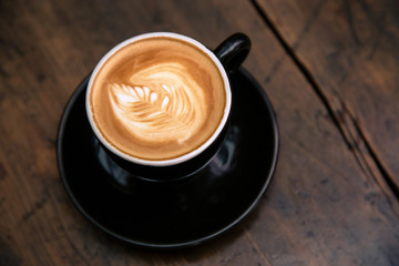 Cup of coffee on wooden table