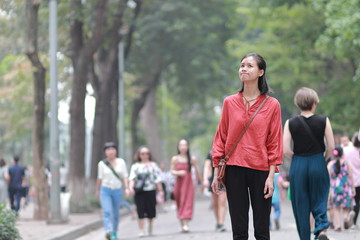 Fototapeta premium young woman in the crowd