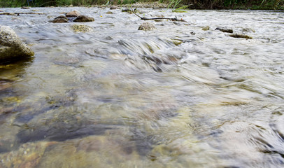 Canal landscape with water flowing through rocks