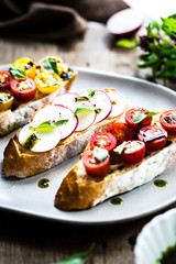 Bruschetta with Cherry Tomatoes and Radish with Basil oil,
