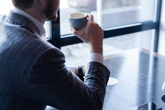 Take A Break And Have Coffee. Business Man Drinking Coffee In A Cafe.