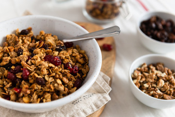 Dry breakfast cereals. Crunchy honey granola bowl with flax seeds, cranberries and coconut. Healthy and fiber food. Breakfast time. Dieting