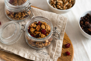Dry breakfast cereals. Crunchy honey granola bowl with flax seeds, cranberries and coconut. Healthy, vegeterian fiber food. Breakfast time. Dieting