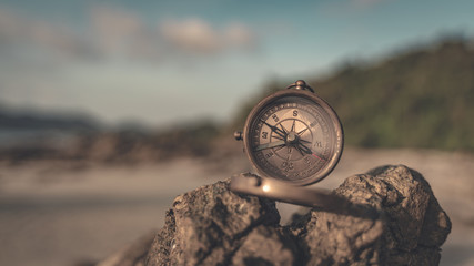 Compass On Stone With Sea View Background