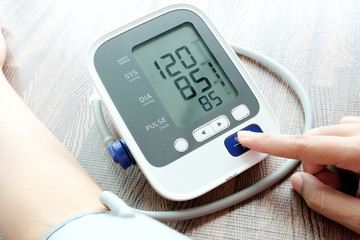 Man check blood pressure monitor and heart rate monitor with digital pressure gauge. Health care...