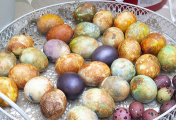 Obraz na płótnie Canvas Colored, multicolored easter eggs in a basket.