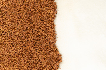 Black coffee with sugar scattered on the table. Background.