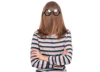 Headshot portrait of funny Teen Girl with her hair on her face wearing eyeglasses, keeps arms...