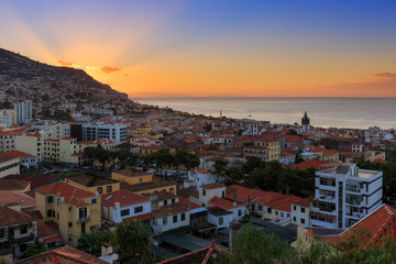 Beautiful skyline cityscape of the city Funchal on the island Madeira at sunrise in summer