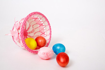 easter eggs in basket on white background