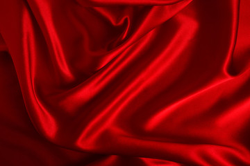 Obraz premium Red silk or satin luxury fabric texture can use as abstract background. Top view.