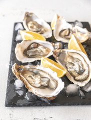 Raw oysters on the slate board