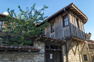 Old houses with vine at autumn in old town Nessebar, Bulgaria