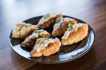 Croissant with Tuna Salad  Sandwich on wood table