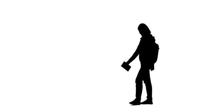 Woman looking around and writes something in a block. Silhouette. White background. Side view
