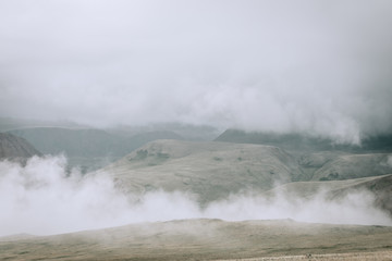Panorama and a scene of beautiful and majestic mountains against the background of a cloudy sky...