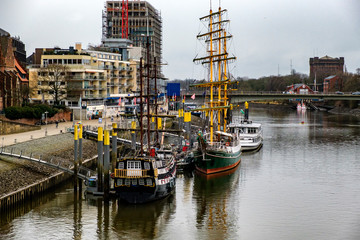 Alexander von Humboldt tall ship and others wooden sailing ships and barg floating on the banks of...