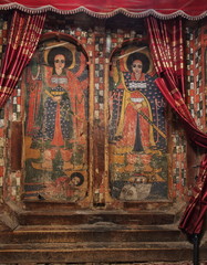 TIGRAY, ETHIOPIA - February 25, 2019: iconographic scenes and wall murals of saints painted in Selassie Chelokot church