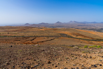 Spain, Lanzarote, Volcanoes in brown and orange volcanic rock landscape