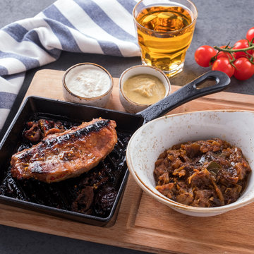 Bigas with brisket on an edge on a wooden board