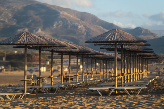Bamboo, reed, straw beach umbrellas on the beach Falasarne, Greece, Crete
