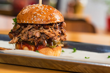 Close up tasty burger with minced meat served on tray