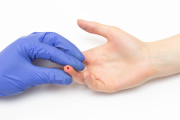A doctor makes a general blood test to a female patient for a study of red blood cell and...