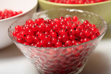 Fresh red currants in bowl close up