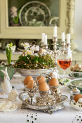 Obraz na płótnie Canvas Easter table setting with vintage decoration